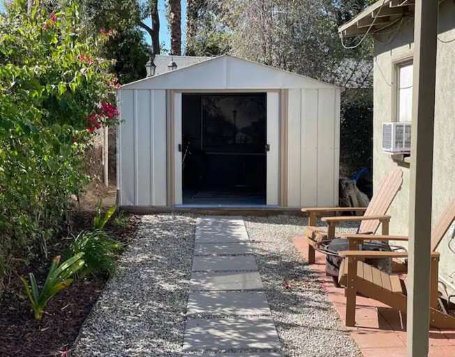 Cottage shed - washer & dryer with bikes inside Cottage shed - washer & dryer with bikes inside
